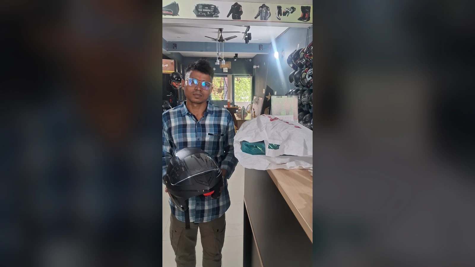Happy customer receiving free assured gift package with certified helmet at Bikers Accessories Bihar Sharif